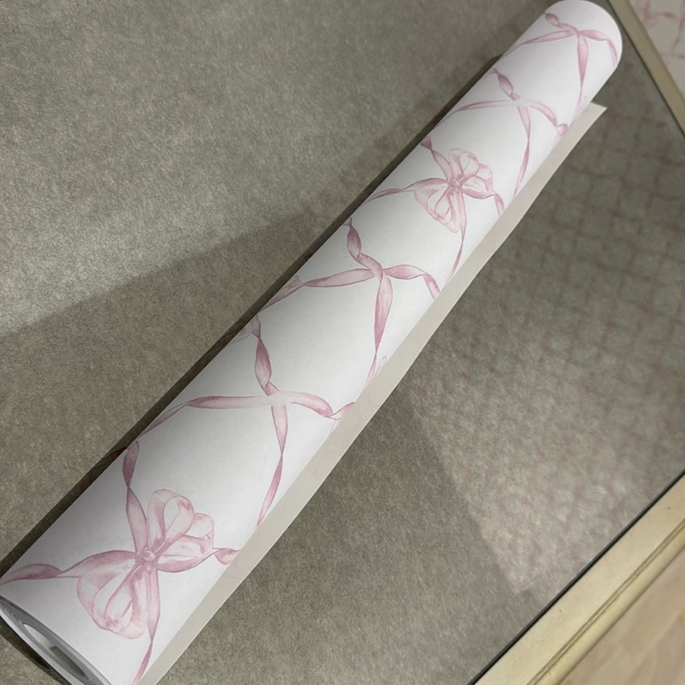 Roll of Baby bow faded primerose ribbon trellis wallpaper